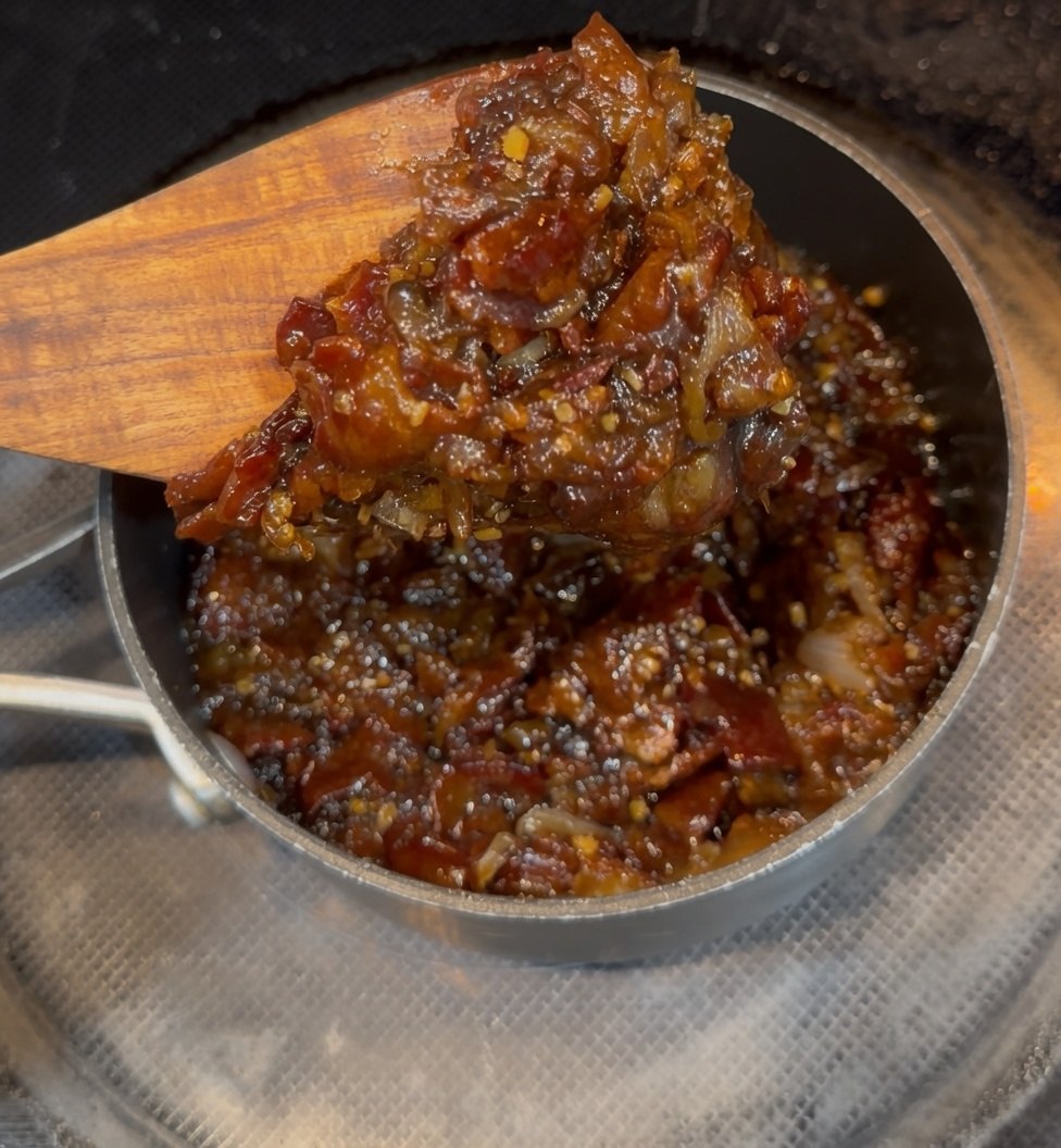 The first batch of 603 Bacon Jam cooking low and slow in the pan